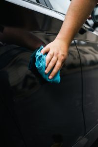 wiping the Ceramic Waterless Car Wash from Rain-X