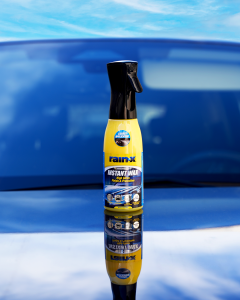 a bottle of instant wax on a car