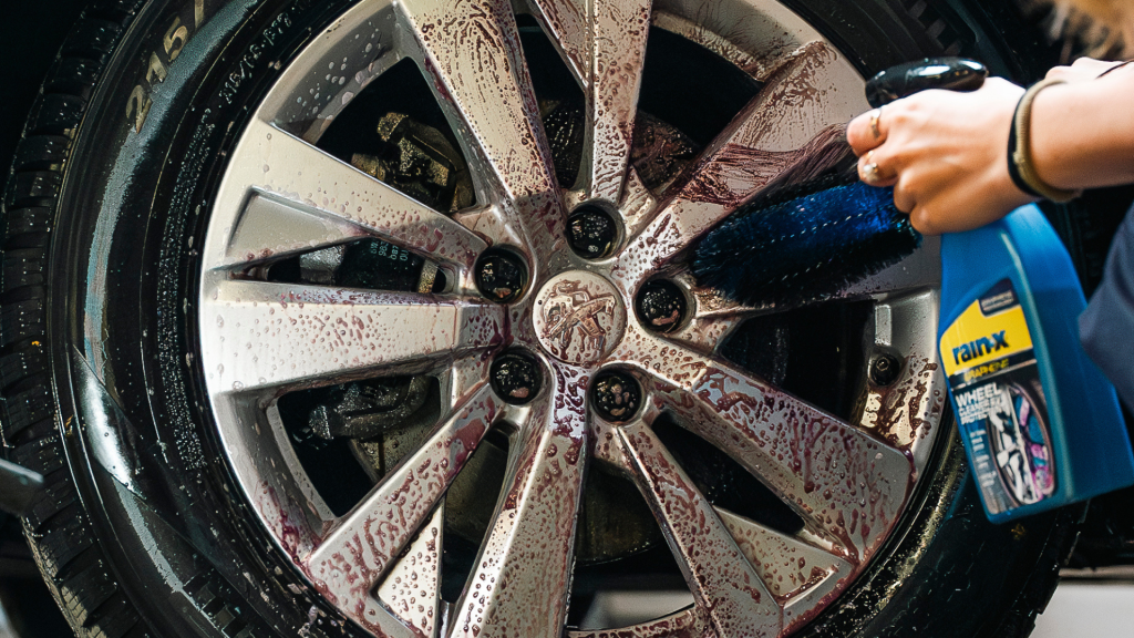Someone using the Rain-X Wheel cleaner 